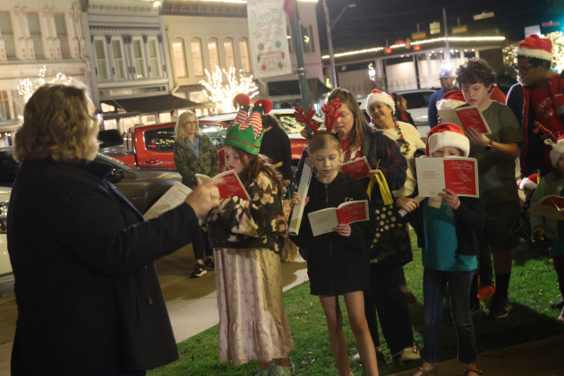 Children from the First Presbyterian Church LOGOS Program spread Christmas cheer in downtown Georgetown earlier this month. Children look forward to dressing up in Christmas attire and singing their favorite carols for visitors downtown during the annual event for the church, which sits just one block east of the square. (Photos courtesy Ron Parks Photography)