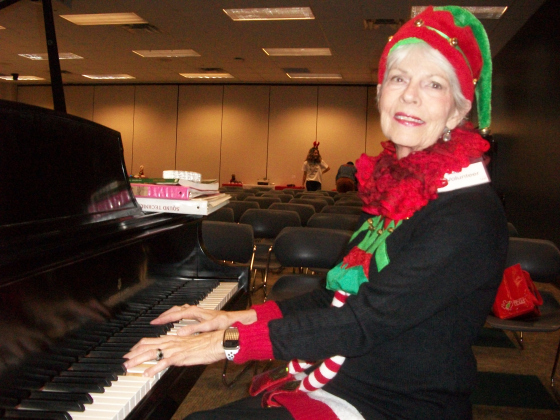 Sun City resident Judi Stanfield entertains guests during the Camille’s Memory Café Christmas party December 16 at Georgetown Public Library. (Photos by Brad Stutzman)