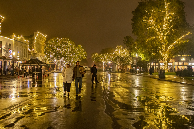 Main Street’s surface was shining with a coating of precipitation after the conclusion of the Lighting of the Square Friday, November 25. A rainy night was no impediment for Georgetown families embracing the holiday spirit. (Photos by Andy Sharp)