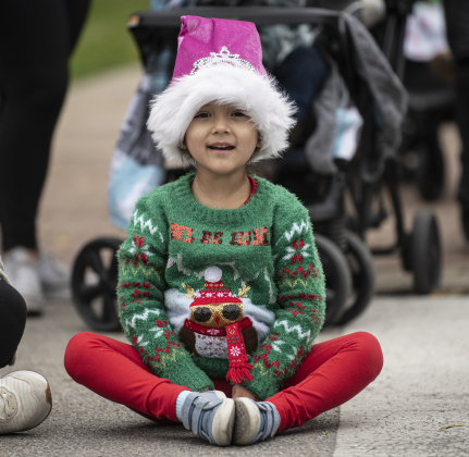 Adelyn Ortuno, 4, gets ready to watch the parade.