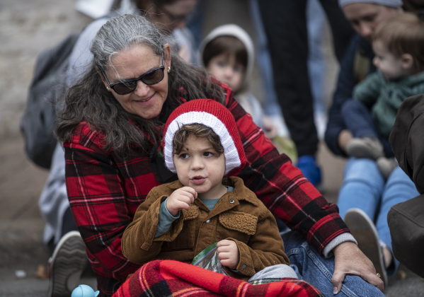 Jude Zangl, 3, watches the parade along Austin Avenue with his grandmother, Marilyn Zangl.