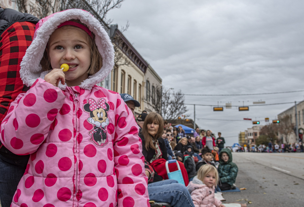 Bundled up in her Minnie Mouse jacket, 6-year-old Katherine Knarr enjoyed watching the parade along Austin Avenue during the Georgetown Christmas Stroll on Saturday, December 3.