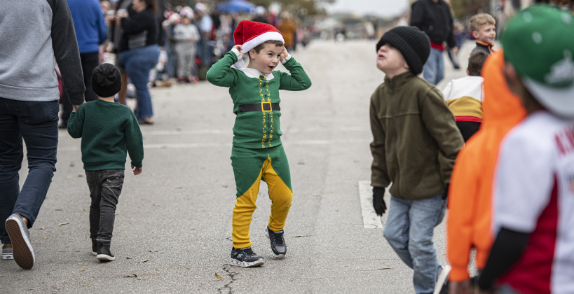Dressed in his finest elf attire, 6-year-old Bowen Currey adjusts his Santa cap at Georgetown's Christmas Stroll on Saturday, December 3, as he gets ready to watch the parade along Austin Avenue with family and friends. (Photos by Andy Sharp)
