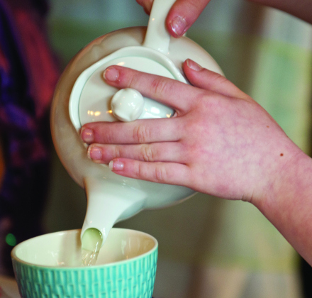 Regan Dansen pours herself a cup of tea at the tea party January 8, 2012.  (Sun Archive)