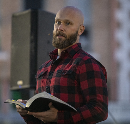 Pastor Charlie Turner conducts the Christmas Eve service held by his church, River Rock Bible Church December 24, 2020.
