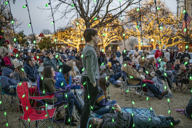 Attendees gather on the Main Street side of the courthouse lawn for a Christmas Eve service held by River Rock Bible Church on Thursday evening, December 24, 2020. Although a cold night, at least 200 people attended the service.  (Sun Archive)