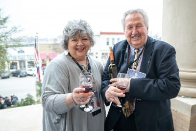 2019 Honorary Chairs Jim and Cindy Harrington hold their Georgetown Swirl glasses. (Courtesy of Williamson County)