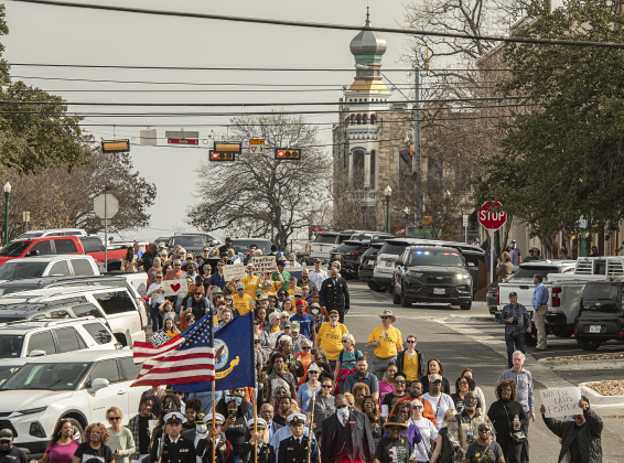 Marchers make their way along Seventh Street in Georgetown during the Dr. Martin Luther King, Jr. holiday celebration march from the square Monday,  January 16. The march was followed by a service at Macedonia Baptist Church. (Photos by Andy Sharp)