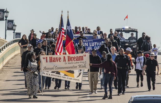 Participants march on South Mays during Round Rock's 36th Annual Commemorative Dr. Martin Martin Luther King, Jr. Celebration on Saturday, January 14. The march was followed by a program at the Allen R. Baca Center.