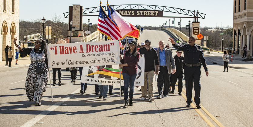 Participants march on South Mays Street during Round Rock's 36th Annual Commemorative Dr. Martin Martin Luther King, Jr. Celebration on Saturday, January 14. The march was followed by a program at the Allen R. Baca Center. (Photos by Andy Sharp)