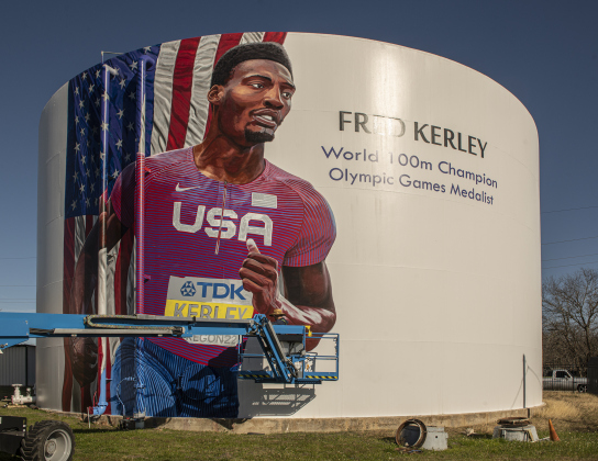 The mural is being painted on the Ford Ground Storage Tank at 1606 North Main Street.