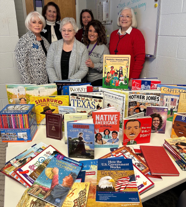 Members of the Robert Gilbert Livingston Chapter, National Society Daughters of the American Revolution, donated 145 English and Sp (anish elementary-level history books for their Community Classroom Project. COURTESY OF ROBERT GILBERT LIVINGSTON CHAPTER