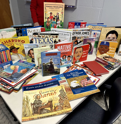 Members of the Robert Gilbert Livingston Chapter, National Society Daughters of the American Revolution, donated 145 English and Sp (anish elementary-level history books for their Community Classroom Project. COURTESY OF ROBERT GILBERT LIVINGSTON CHAPTER