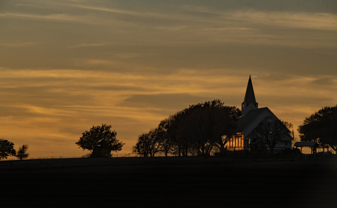 The last rays of the day’s sunlight fall on Prince of Peace Lutheran Church during the last week of 2022. The church is located on County Road 417 northwest of Taylor.  (Andy Sharp)