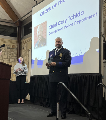 Georgetown Police Chief Cory Tchida holds a plaque after being named the chamber’s Citizen of the Year Thursday, January 26, at the annual chamber gala. (Photo by Kate St. Clair)
