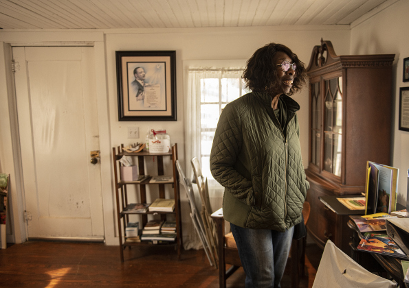 Carol Sharp of Round Rock tours the Shotgun House Museum on Saturday, February 18.  The museum, at 801 West Street, is  maintained by the Georgetown Cultural Citizen Memorial Association, was open today as part of Black History Month events in Georgetown. Photos by Andy Sharp.