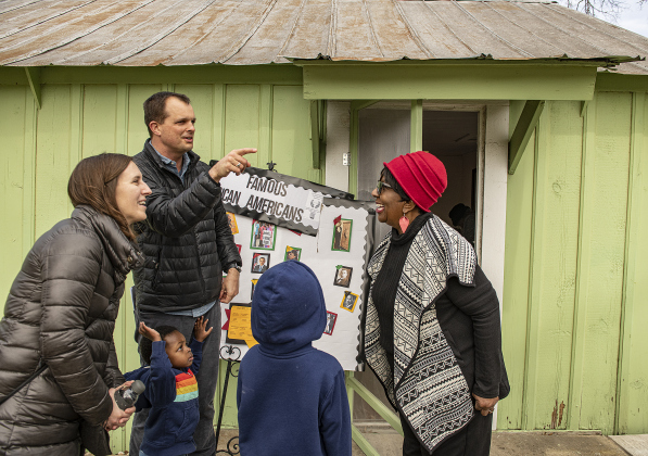 Reverend Bobby Hulme-Lippert, pastor at Georgetown's First Presbyterian Church, was accompanied by his wife Michelle and their children Logan, 2, and Leo, 7, as they visited with Paulette Taylor, right, at  the Shotgun House Museum on Saturday, February 18.