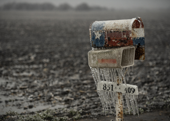 A Texas-themed mailbox is covered in ice along County Road 409 Wednesday, February 1, near Circleville. (Photos by Andy Sharp)