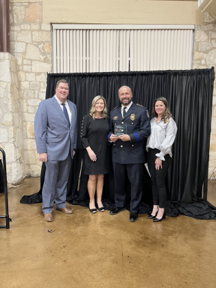 Mike Howell, Shontel Mays, Cory Tchida and Karin Sladek gather for a photo after Mr. Tchida is named Citizen of the Year.