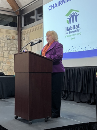 Debbie Hoffman accepts the Chairman Award for Habitat for Humanity.
