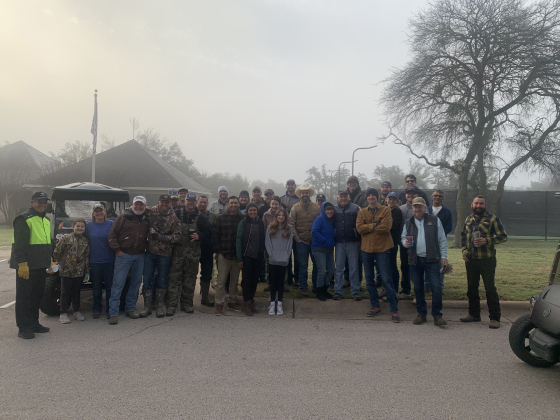Berry Creek residents, including District 5 Council Member Kevin Pitts, worked together Saturday, February 4, to clean up fallen limbs and branches throughout the neighborhood. (Photo by Brigid Cooley)