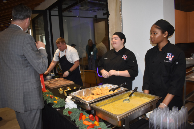 East View High School Culinary students (from left) Linda Fajardo and EriAnner Hays share poblano corn chowder and jalapeño cornbread with diner Chris Gleason. He gave both “five stars.”