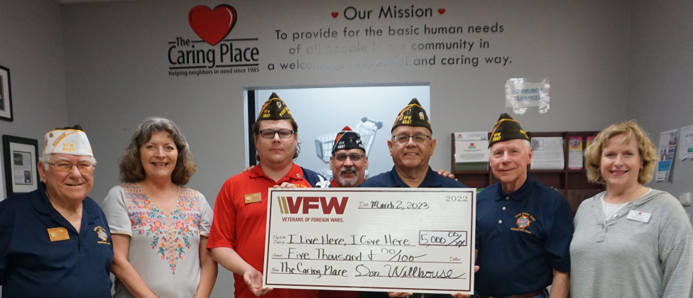 From left, Jim Holden, post quartermaster; Rita Turner, community engagement manager – The Caring Place; Abran Yates, post senior vice commander; Ray Sanchez, post adjutant; Frank Espinosa, Jr., post webmaster; Reggie Brockwell, post member; and Ginna O’Connor, The Caring Place executive director.