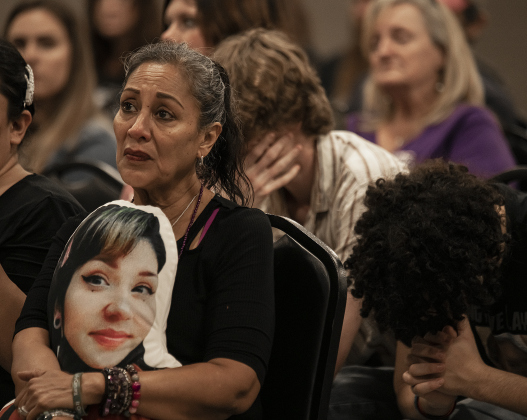 JoAnn Lopez is pictured at the Williamson County Expo Center on Tuesday, March 7,  as she holds a pillow bearing a photo of her granddaughter, Victoria Trevino, who died after a fentanyl poisoning at age 26.