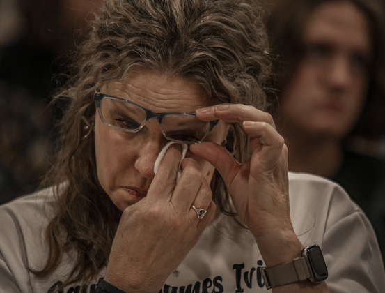 Rhonda Schwertner, a grandmother of fentanyl poisoning victim Layton Ivins, who died at age 16 in January, wipes away a tear.