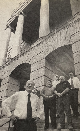 Browning Construction President James Browning and his team stand at the courthouse after being selected as contractors for the 2000s restoration project.