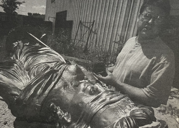 Ironsmith Nick Brumder restores Themis, who stands atop the Williamson County Courthouse.