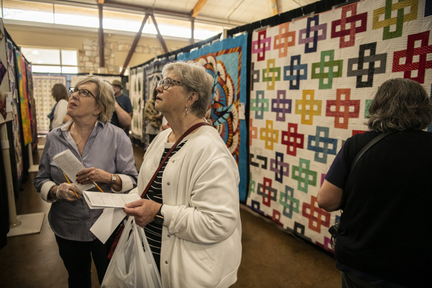 Nancy Ciecko, left, and Susie Monk look at  quilts on Saturday, March 25, at the annual Georgetown Quilt Show.