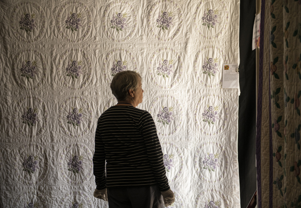 Penny Strack looks at a quilt created by Carolyn Kirkland.