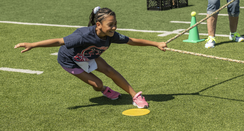 8-year-old Marley  Thompson participates in a tug-of-war during  the Chase the Chief  Fitness Challenge  held at the East View High School track and field on Sunday.