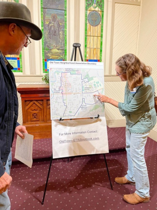 Residents look over the Old Town neighborhood boundaries during the meeting.