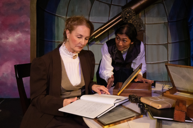 Joanna Gunaraj, right, plays astronomer Henrietta Swan Leavitt in the Palace Playhouse production of “Silent Sky.” Ms. Gunaraj is joined by Linda Myers, who portrays astronomer Annie Jump Cannon in the show. Courtesy Suzanne McBride