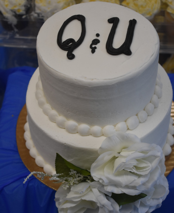 Guests enjoyed a real wedding cake decorated with the letters “Q” and “U.”