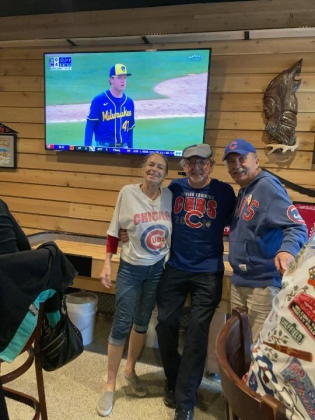 Cubs fans Sue Bryson, Bill Hougesen and Jim Bonk watch a game in Sun City on opening day. Photo by Linda Dwyer