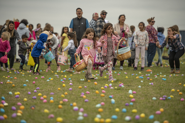  Kids dash into a field for Easter eggs. Photos by Andy Sharp