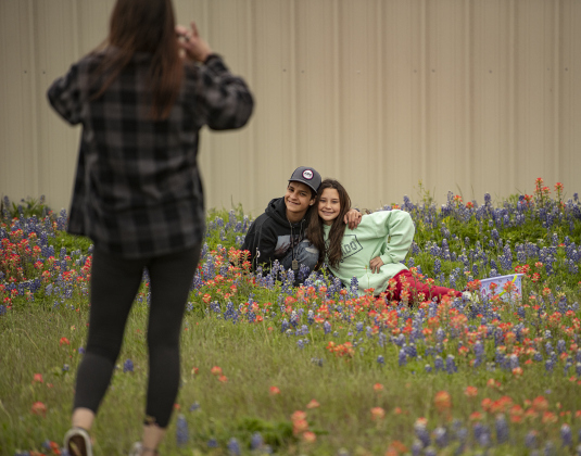 Cecelia Davis takes wildflower photos of her kids, including Tristan, 11, and his sister Abbigail Chandler, 13.