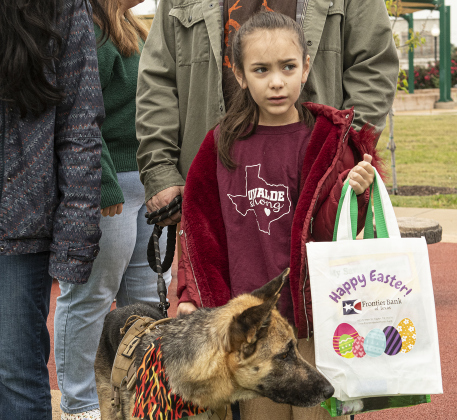 Clara Trent, 7, and her dog, Wiley, joined in the fun during Taylor's Easter Egg Hunt.