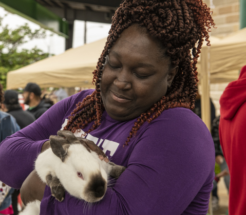 Shamika Darnell pets a rabbit.