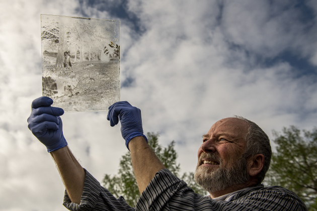 Tom Cavness  holds the result of an exposed glass plate he just created  at Bull Branch Park on Sunday, April 9.