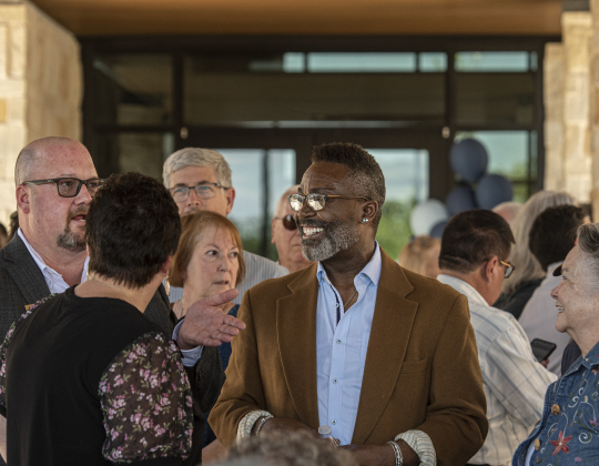 Guests and residents gather for the grand opening ceremonies. The Hacienda at Georgetown, adjacent to the Sun City neighborhood, is a luxury senior living community offering leases in studio, one-bedroom and two-bedroom layouts. It offers independent living, assisted living and memory care.