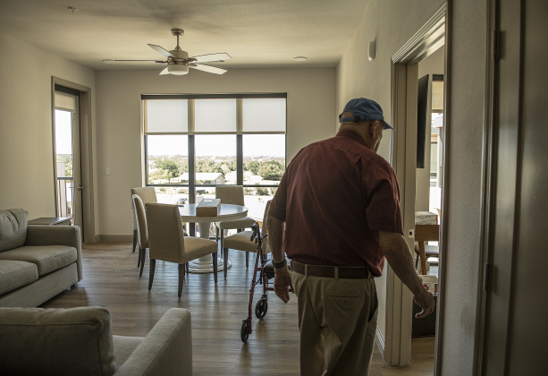 Future resident Bob Baer, 91, looks over the 2-bedroom apartment where he and his wife will soon live at The Hacienda at Georgetown after the  grand opening ceremonies on Saturday, April 15.