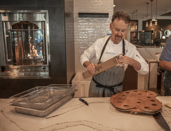 Chef Stephan Pyles helps prepare his new restaurant, Alma, for a special night at The Hacienda at Georgetown during Hacienda’s grand opening ceremonies on Saturday, April 15. Alma shares space with the new complex, but the restaurant will also be open to the public beginning in May. On this day, however, a celebration dinner was being held there. For Hacienda residents, there are also several dining spots specifically for them.