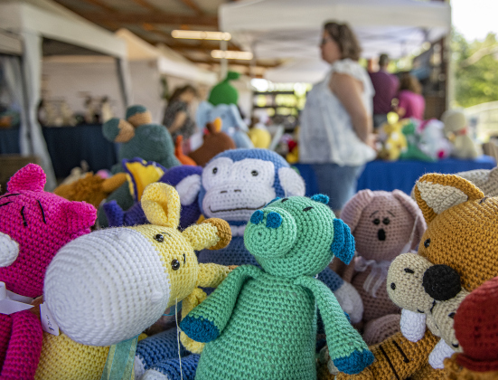 Heather Zana watches over crocheted creations at the Made to Order vendor booth  in the  Murphy Park pavilion during the Cinderella's Closet "A Magical Spring Affair" fundraising event on Saturday, April 22.