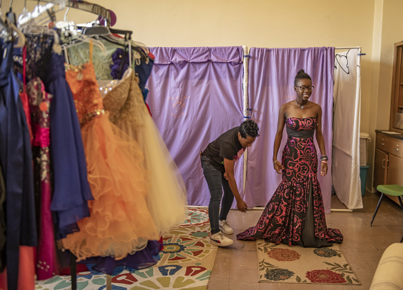 17-year-old Jamia Townsend, right, gets help from her mom Monique Owen as she tries on prom dresses at Cinderella's Closet on Saturday, April 22, 2023.  Her Taylor High School prom is May 6.