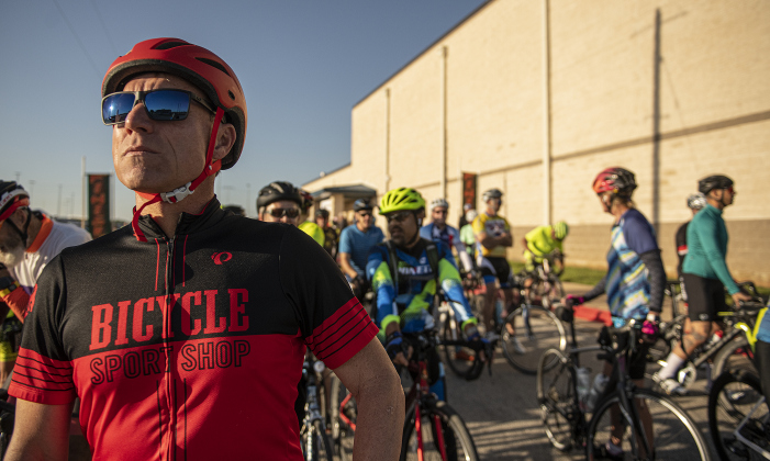 Chance Leigh, who was doing a 100-mile ride, gathers with fellow cyclists near the starting area.