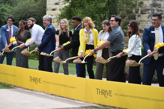 In a ceremonial groundbreaking April 14, President Laura Skandera Trombley (center), Trustee chair Christopher Cragg (fourth from left), Trustee Lynn Mock (second from right), and students kick off the university’s $150 million building project.